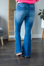 Load image into Gallery viewer, Back view of model wearing flare jeans.

