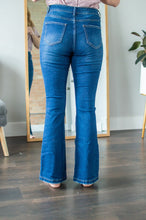 Load image into Gallery viewer, Back view of model wearing flare jeans.
