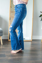 Load image into Gallery viewer, Side view of model wearing button fly flare jeans
