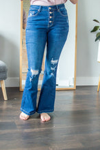 Load image into Gallery viewer, Model wearing dark wash flare jeans
