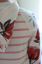 Load image into Gallery viewer, Hood and sleeve detail on floral sweatshirt.
