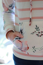 Load image into Gallery viewer, Pocket detail on floral sweatshirt.
